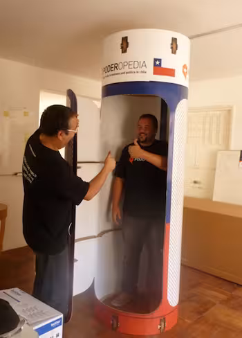 Poderopedia's Miguel Paz (CEO) and Rodrigo Guaiquil (COO) in a capsule - a reference to the rescued Chilean miners and to data mining