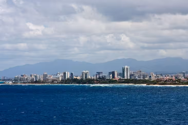 Tropical coast of Puerto Rico with the skyline of San Juan via Pond5