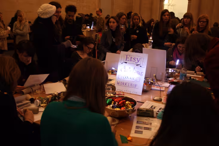 Attendees at the craft table making christmas crackers
