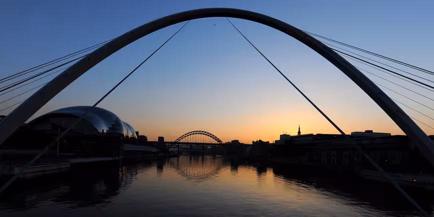 The sun sets behind the Tyne Bridge