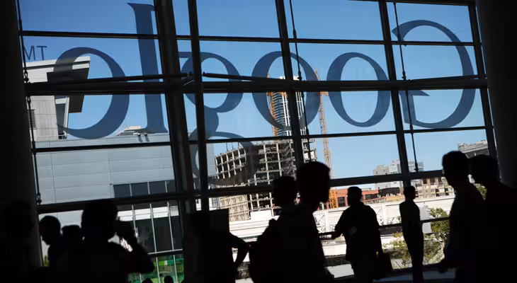 A Google logo is seen through windows of