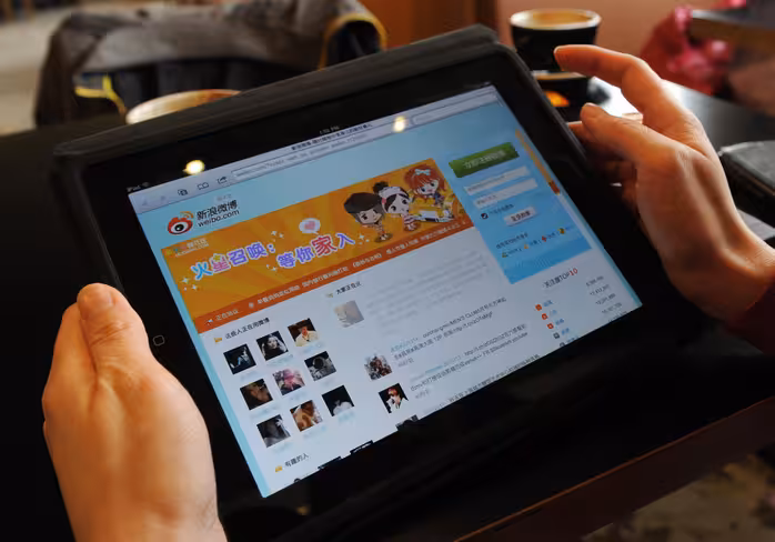 A woman views the Chinese social media w
