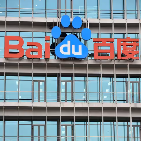 A Chinese worker cleans the balcony of C
