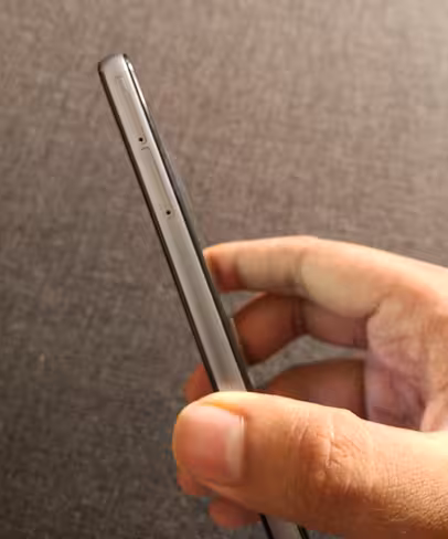 There are two SIM slots on the left side, one of which supports a microSD card for expandable storage