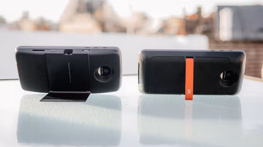 Left: Insta-share projector. Right: JBL SoundBoost speakers