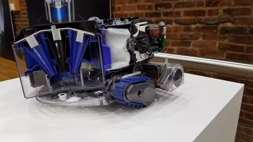 A dissected Dyson 360 Eye which shows the Root Cyclone component, as well as the camera and motherboard
