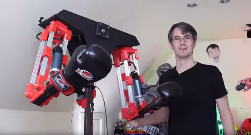 Mad scientist builds a robot to beat the crap out of him in a VR fighting game