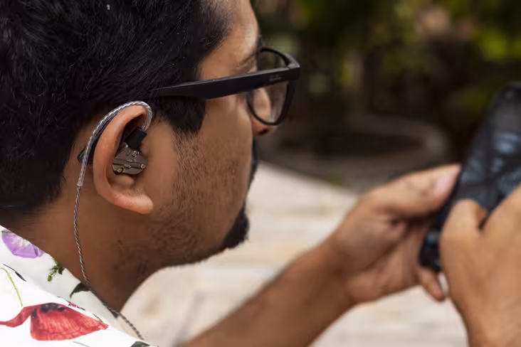 The RevoNext QT5 Earphones have plastic sheaths on the cable to allow it to sit snugly around your ears