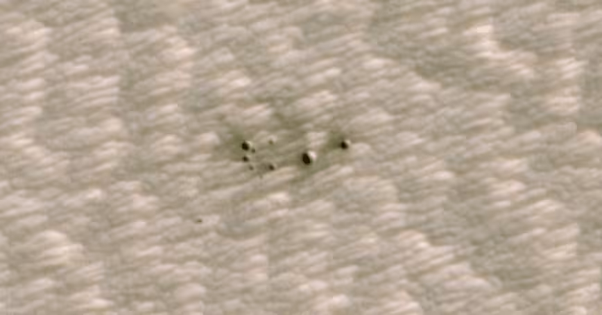 NASA releases images of the first craters on Mars discovered by AI