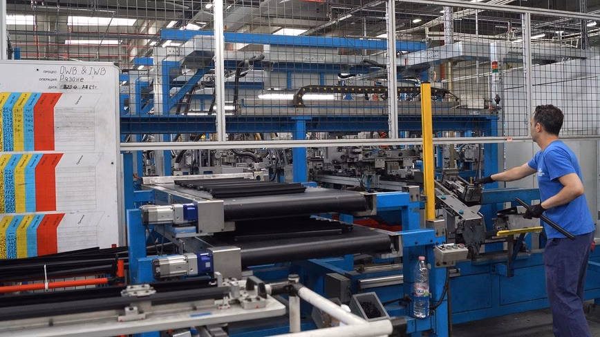 Cars being built in a factory 