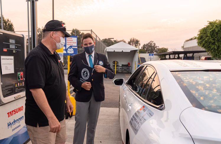 A Guinness Book of World records judge speaks to car driver
