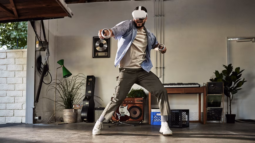 A person demoing Oculus Quest 2 and its controllers