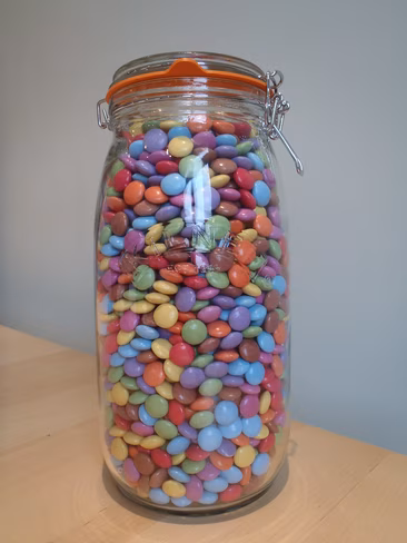 a jar full of colored candies