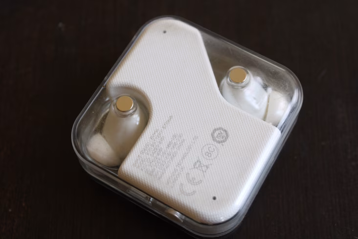 Scratches on the Nothing Ear 1's case after a few months of usage are visible.