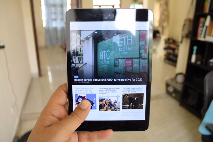The iPad Mini 2 is perfect to hold with one hand.