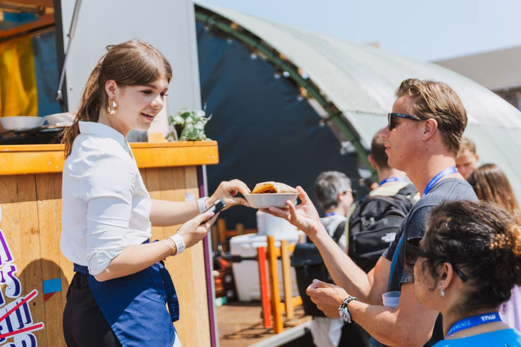 People handing out food from food trucl