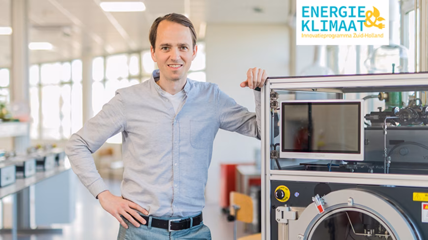The CEO of VSP standing in front of a machine