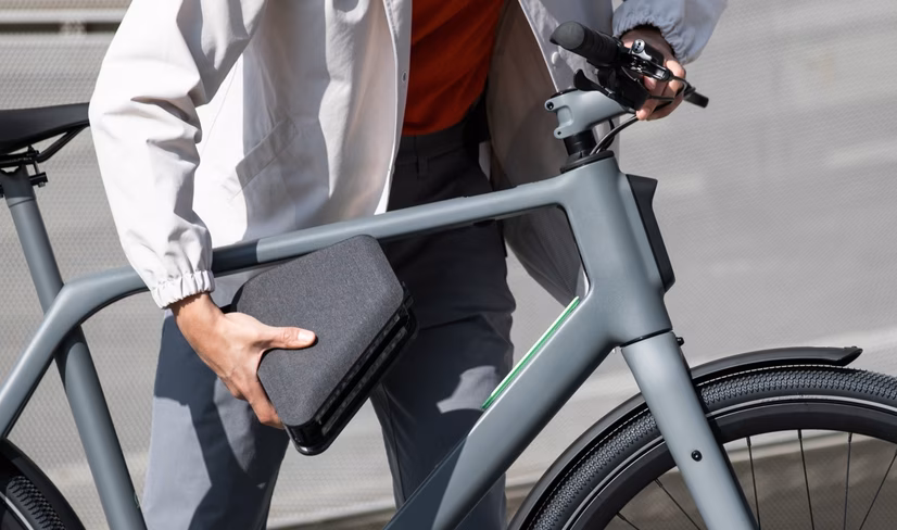 man demonstrates battery placement on lemmo one ebike
