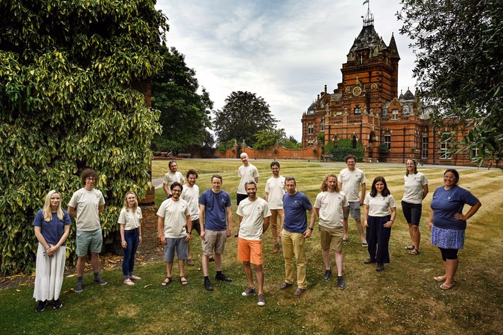 The Phasecraft team posing together on a lawn
