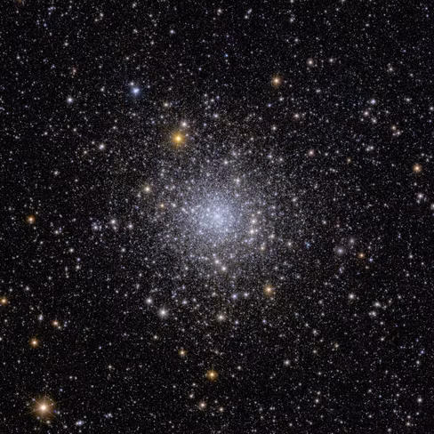 Astronomical image is speckled with hundreds of thousands of stars visible across the black expanse of space.