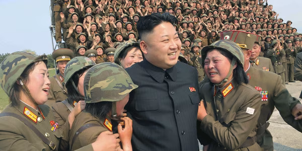 Kim Jong Un surrounded by admiring soldiers