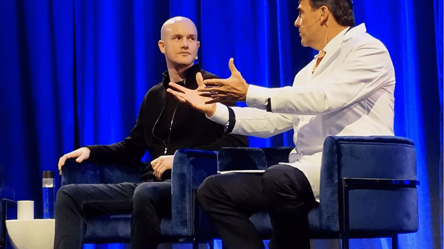 Coinbase is cutting 14 per cent of its workforce. The reason it gave was not the crypto downturn. It was AI.