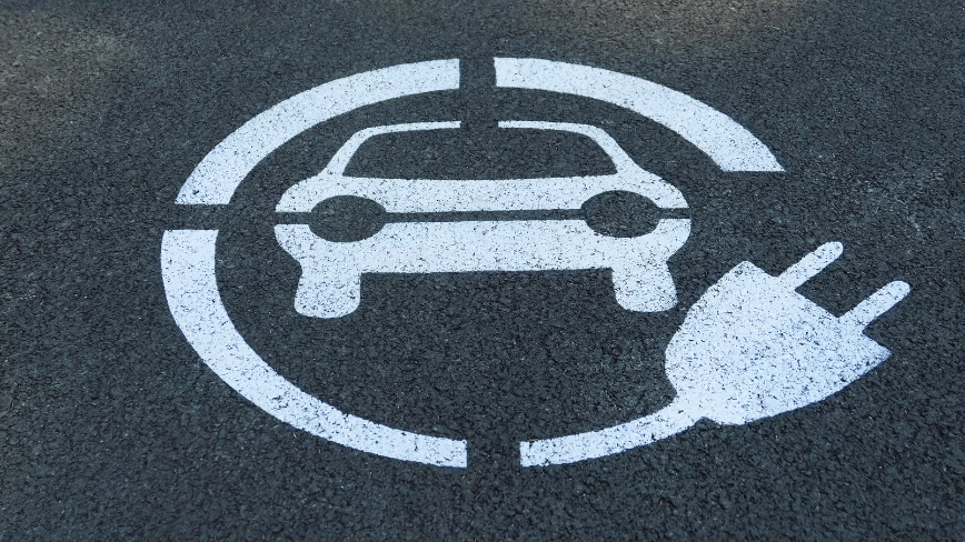 The EVs America is losing in 2026 are not failing. They are being tariffed out of existence.