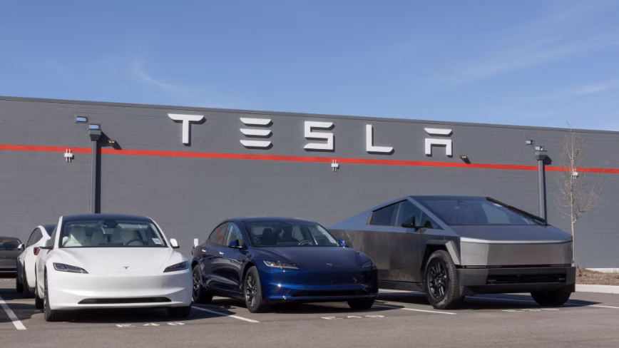 https://media.thenextweb.com/2026/05/tesla-fsd-europe-lithuania-netherlands-expansion.avif