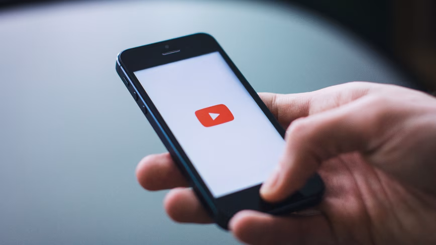 YouTube will now automatically label AI-generated videos, whether creators disclose them or not