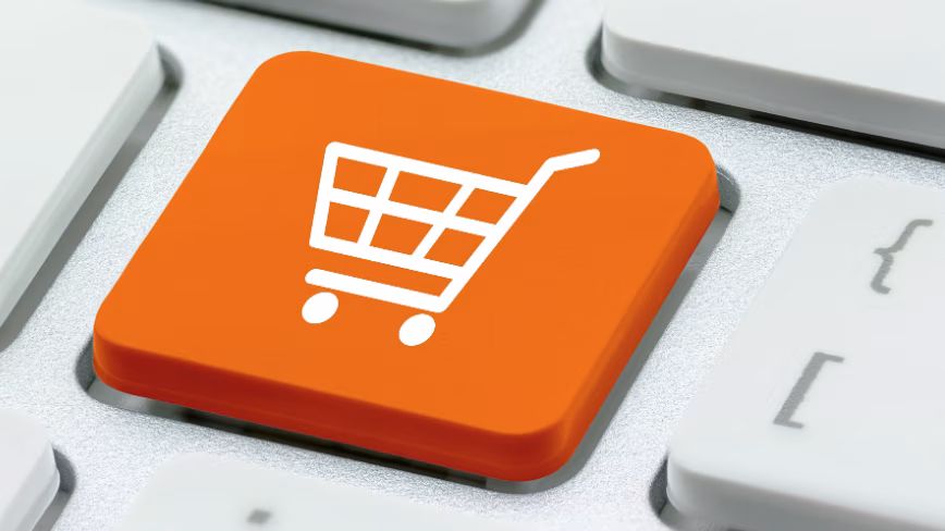 Photo of a White basket for checkout, shopping cart symbol on a laptop keyboard