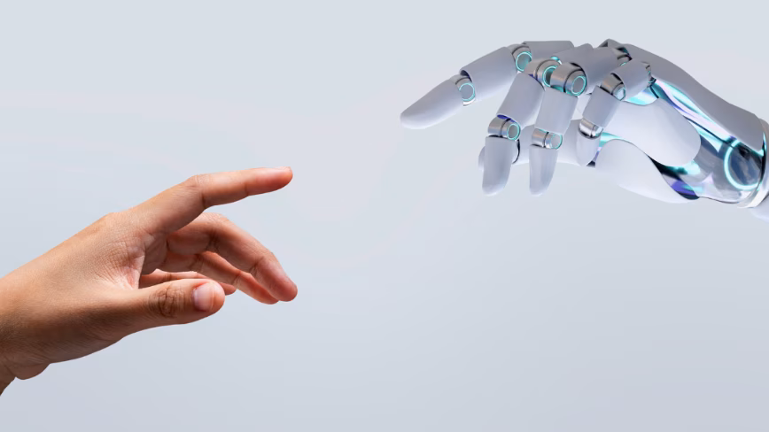 Photo of a human hand approaching an AI robot hand