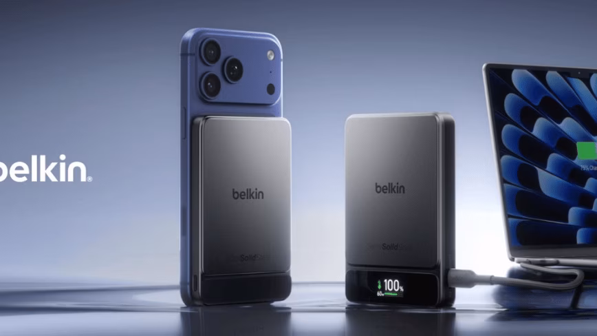 Two Belkin UltraCharge Pro power banks, one attached to a phone and one charging a laptop.