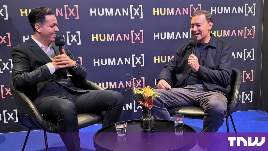 https://media.thenextweb.com/2026/09/cristian-dina-jim-lanzone-laughing-interview-humanx-amsterdam.jpg