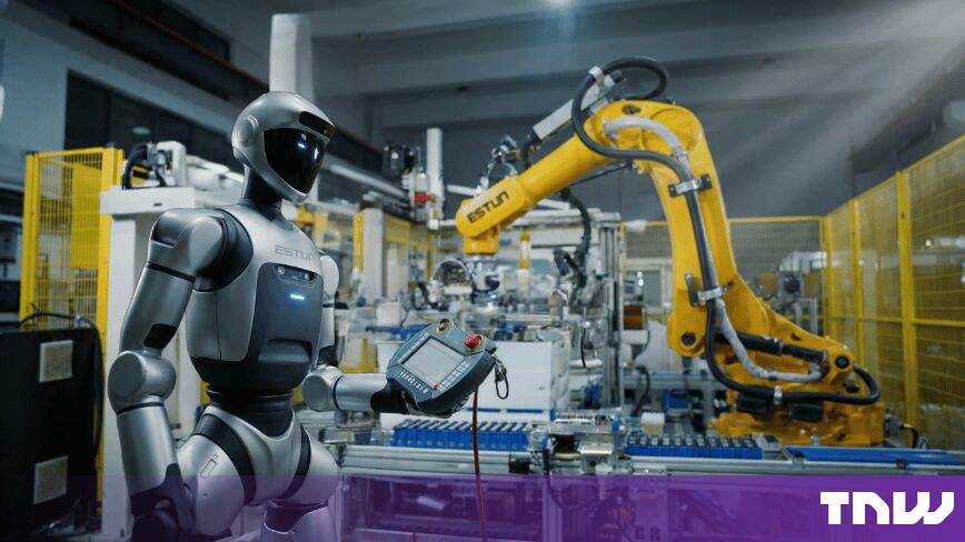 https://media.thenextweb.com/2026/09/humanoid-robot-teach-pendant-yellow-industrial-arm-factory.jpg