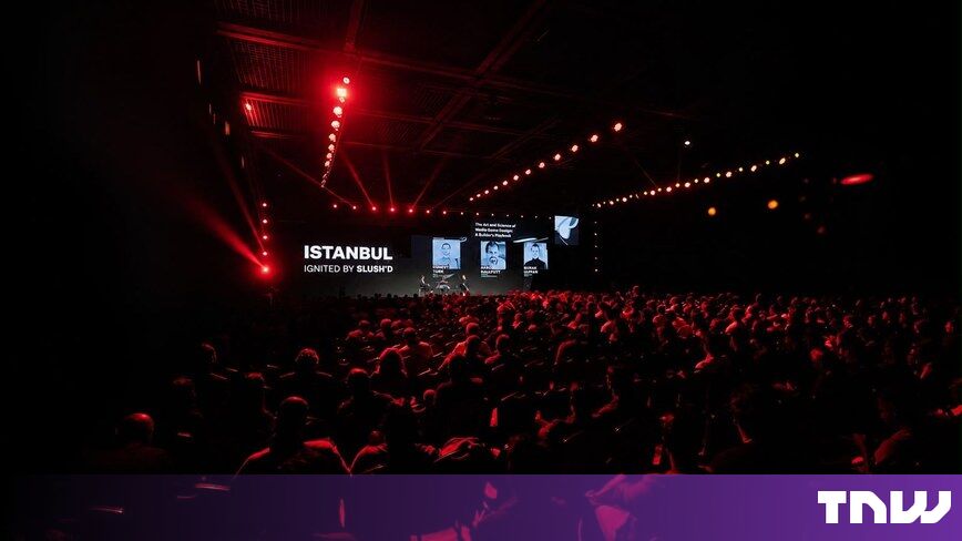https://media.thenextweb.com/2026/09/istanbul-ignited-slushd-main-stage-red-lights-audience.jpg