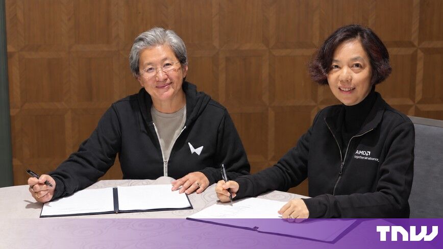 https://media.thenextweb.com/2026/09/lisa-su-fei-fei-li-signing-documents-table.jpg