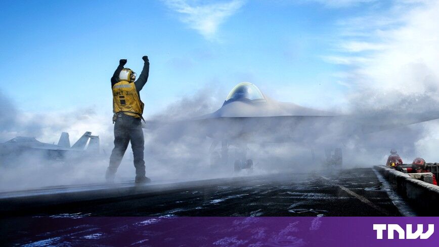 https://media.thenextweb.com/2026/09/navy-f-a-xx-artist-rendering-carrier-deck-flight-director.jpg