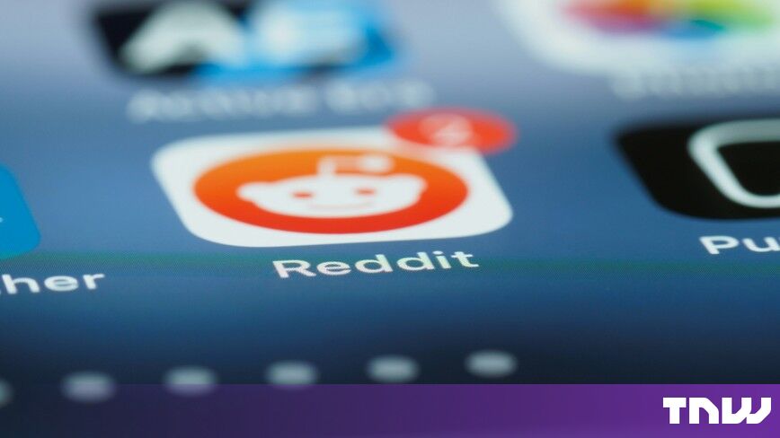 https://media.thenextweb.com/2026/09/reddit-app-icon-iphone-home-screen-close-up.jpg