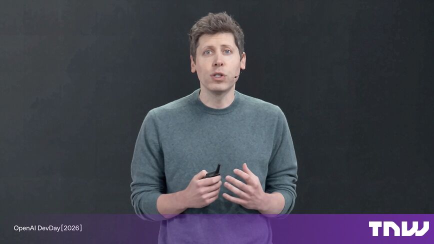 https://media.thenextweb.com/2026/09/sam-altman-green-sweater-speaking-dark-stage-devday-livestream-1736.jpg