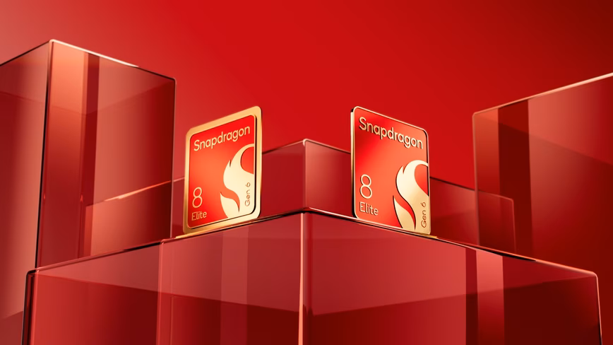 Two red and gold Snapdragon 8 Elite Gen 6 chip badges standing on red glass blocks