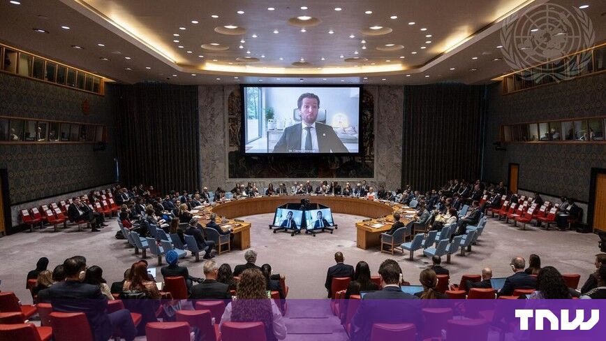 https://media.thenextweb.com/2026/09/un-security-council-chamber-screen-front-view.jpg