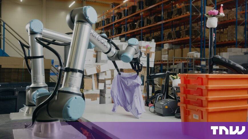 https://media.thenextweb.com/2026/10/dual-arm-robot-sorting-lilac-shirt-warehouse.jpg