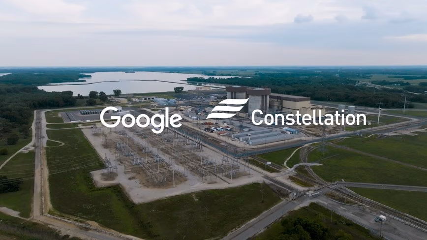 Aerial view of a nuclear plant with two reactor domes, a switchyard and a lake, overlaid with the Google and Constellation logos. Featured Image