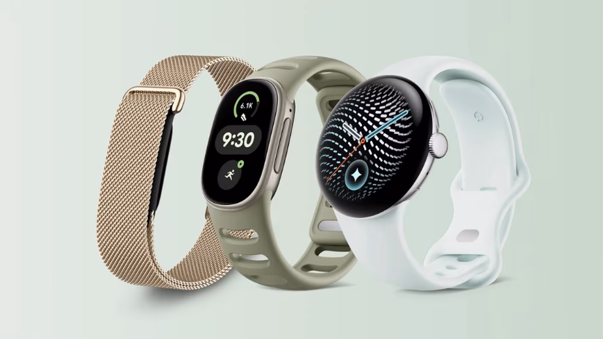 Two Google wearables shown side by side, one with a rounded square screen on an olive strap, the other round on a white strap.