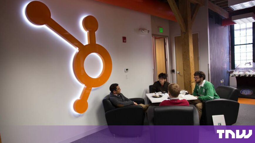 https://media.thenextweb.com/2026/10/hubspot-logo-wall-office-lounge.jpg