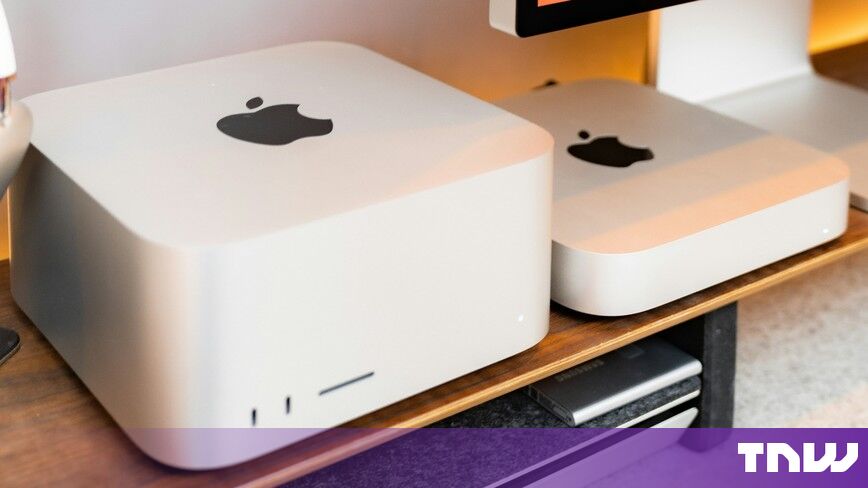 https://media.thenextweb.com/2026/10/mac-studio-mac-mini-studio-display-wooden-desk.jpg