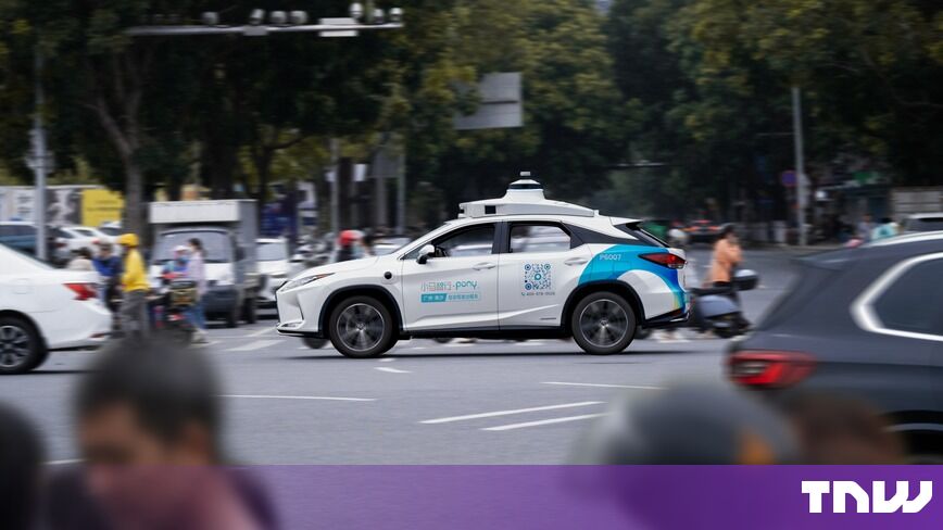 https://media.thenextweb.com/2026/10/pony-ai-robotaxi-lexus-traffic-guangzhou-nansha-street.jpg