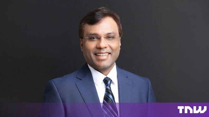 https://media.thenextweb.com/2026/10/rohit-prasad-portrait-navy-suit-dark-background.jpg