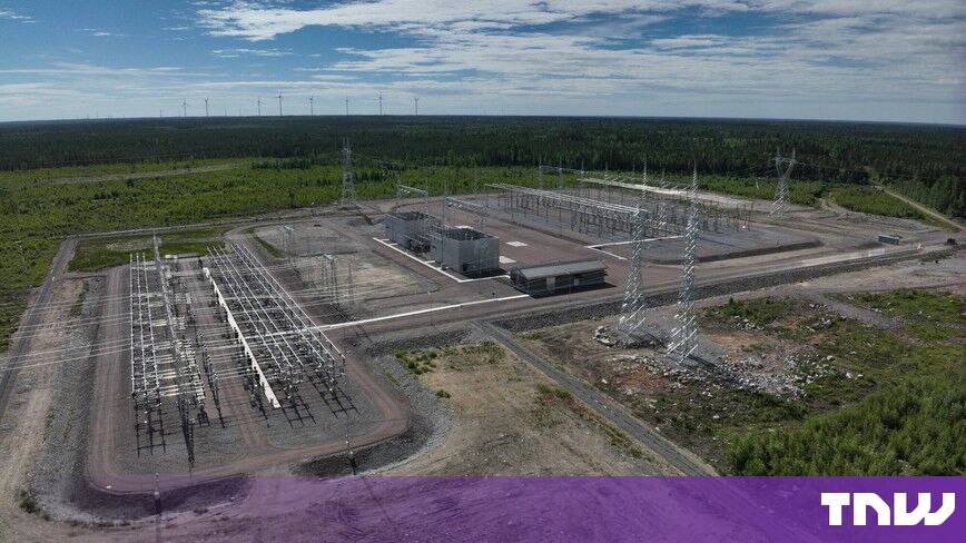 https://media.thenextweb.com/2026/10/substation-aerial-forest-wind-turbines.jpg