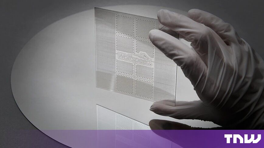 https://media.thenextweb.com/2026/10/wolfspeed-silicon-carbide-interposer-gloved-hand-wafer.jpg